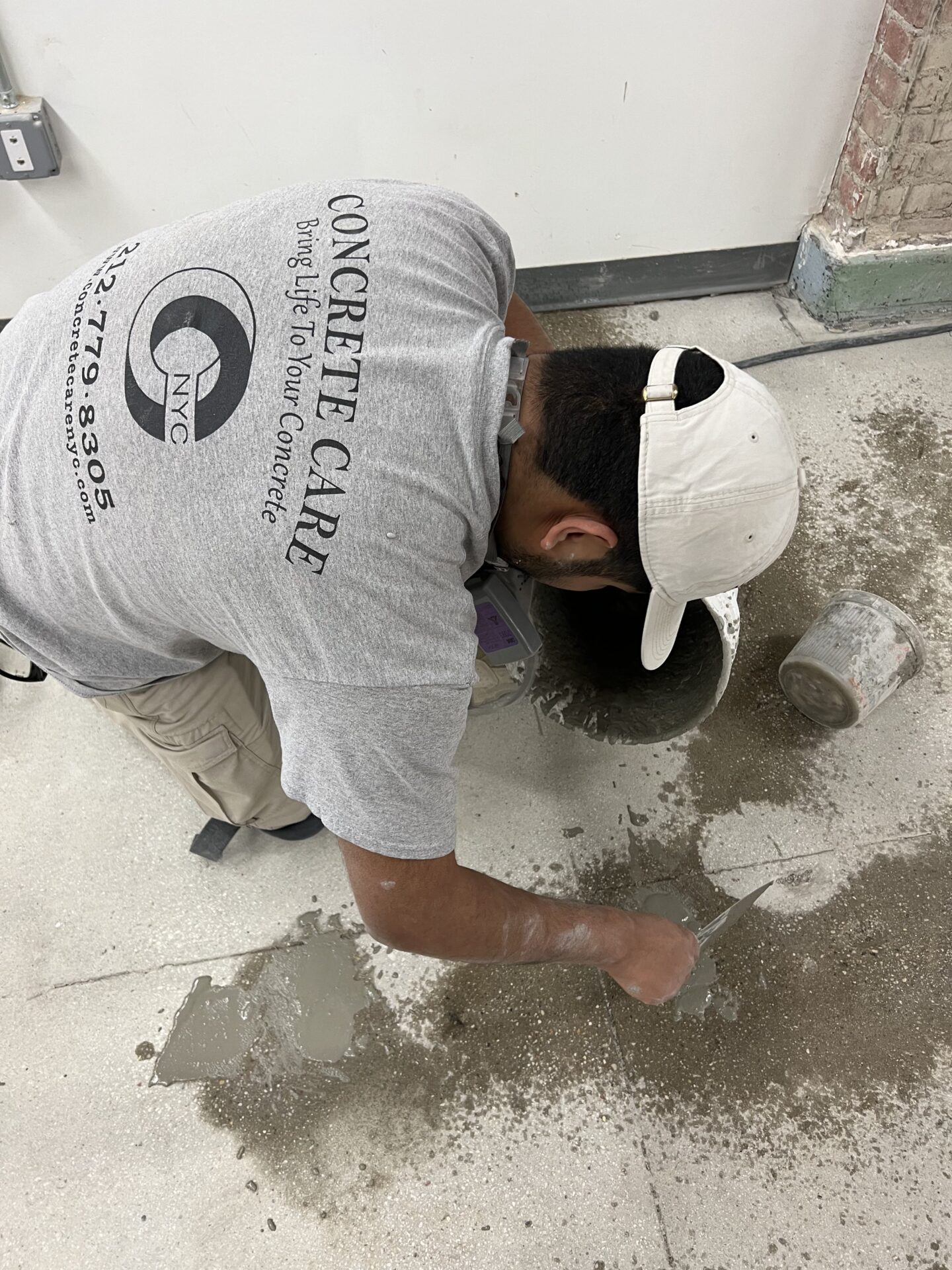 Two mens are cleaning the floor